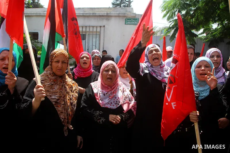 Palestinian supporters of the Democratic Front for the Liberation of Palestine (DFLP) take part in a demonstration infront of the UNSCO in Gaza city on July 26, 2011. In support of the Palestinian President Mahmoud abbas...