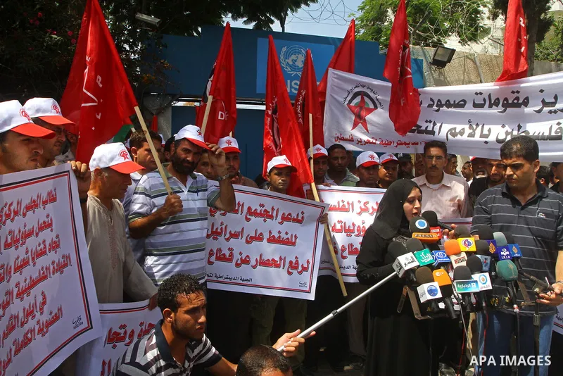Palestinian supporters of the Democratic Front for the Liberation of Palestine (DFLP) deliver speech during a demonstration infront of the UNSCO in Gaza city on July 26, 2011. In support of the Palestinian President Mahm...