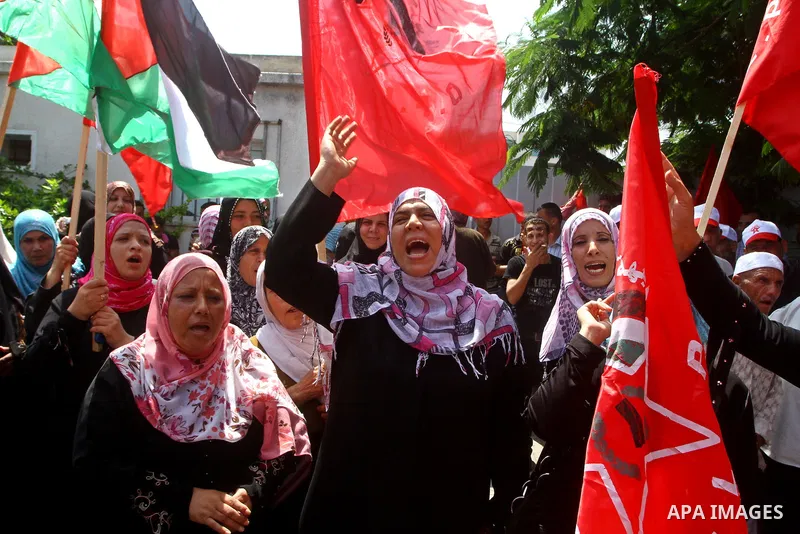 Palestinian supporters of the Democratic Front for the Liberation of Palestine (DFLP) take part in a demonstration infront of the UNSCO in Gaza city on July 26, 2011. In support of the Palestinian President Mahmoud abbas...