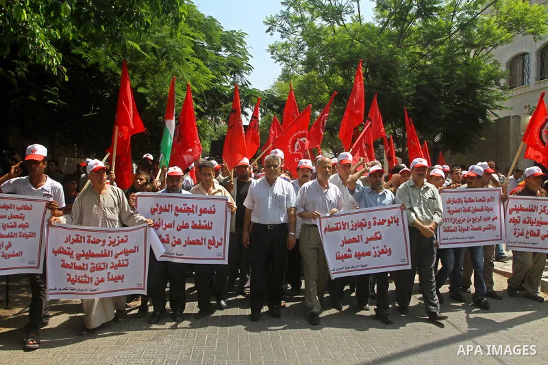 Palestinian supporters of the Democratic Front for the Liberation of Palestine (DFLP) take part in a demonstration infront of the UNSCO in Gaza city on July 26, 2011. In support of the Palestinian President Mahmoud abbas...