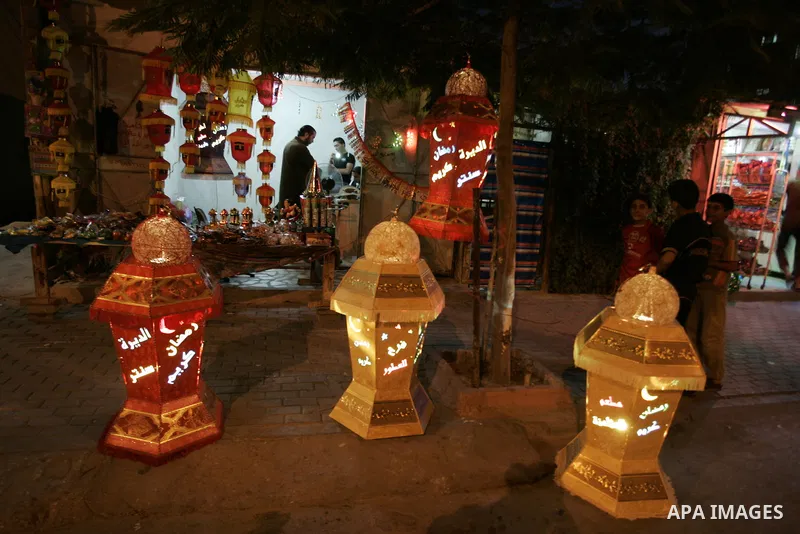 A Palestinian vendor displays a giant lanterns, traditionally used as decoration during the Muslim holy month of Ramadan at a shop in Rafah, southern Gaza Strip on July 26, 2011. The start of Ramadan in the ninth of the...