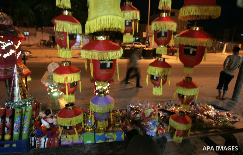 A Palestinian vendor displays lanterns, traditionally used as decoration during the Muslim holy month of Ramadan at a shop in Rafah, southern Gaza Strip on July 26, 2011. The start of Ramadan in the ninth of the Muslim c...
