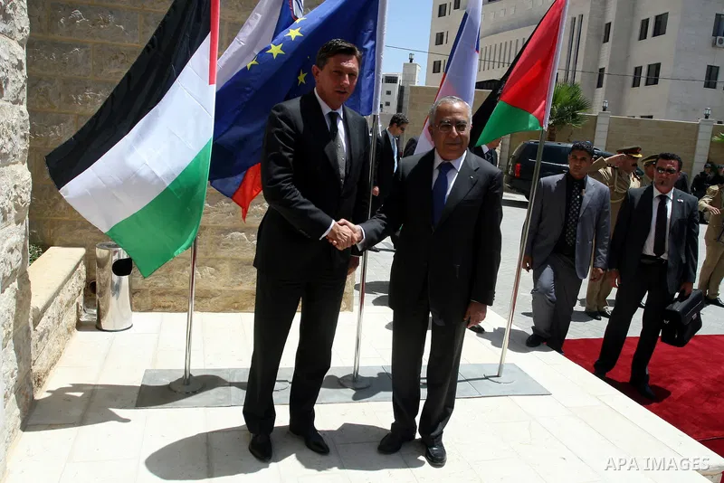 Palestinian Prime Minister Salam Fayyad, shakes hands with Slovenia's Prime Minister, Borut Pahor (L) before their meeting in the West Bank city of Ramallah on July 27, 2011. Photo by Issam Rimawi