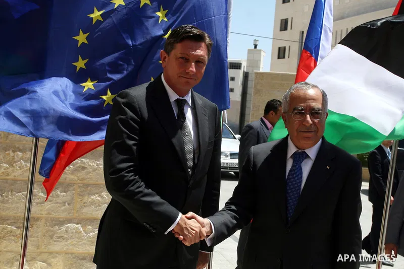 Palestinian Prime Minister Salam Fayyad, shakes hands with Slovenia's Prime Minister, Borut Pahor (L) before their meeting in the West Bank city of Ramallah on July 27, 2011. Photo by Issam Rimawi