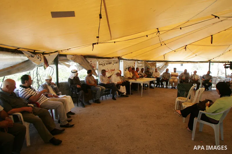 Palestinians take part in the press conference against the settlements, terrorism and the arrest of Palestinian children in the solidarity tent in silwan in Jerusalem on July 28, 2011. Photo by Mahfouz Abu Turk