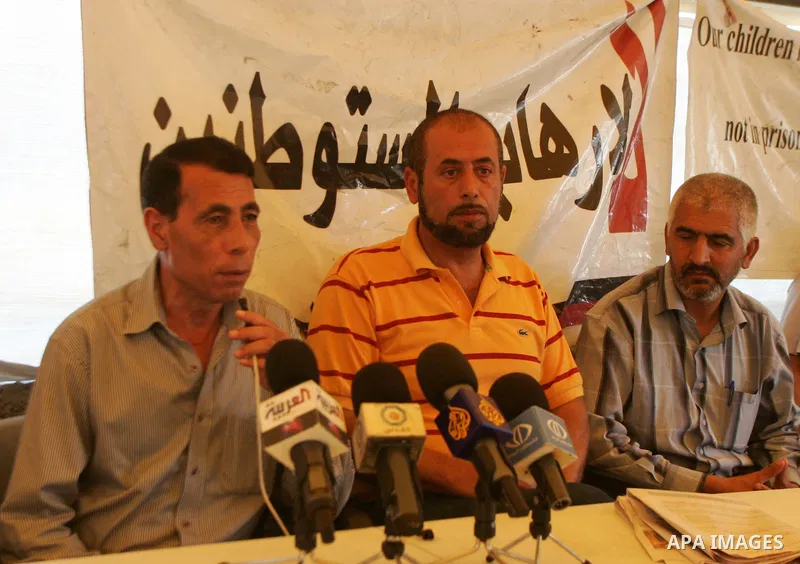 Palestinians take part in the press conference against the settlements, terrorism and the arrest of Palestinian children in the solidarity tent in silwan in Jerusalem on July 28, 2011. Photo by Mahfouz Abu Turk