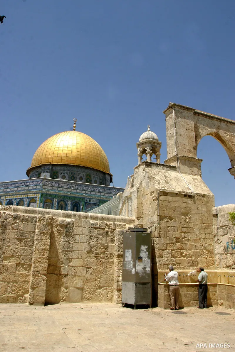 A Palestinian Muslims stand in the yards of al Aqsa Mosque, after al-dohor prayer in the old city of jerusalem in July 27, 2011. Photo by Mahfouz Abu Turk