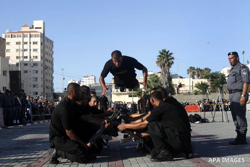 Palestinian Hamas security forces show their skills during a graduation ceremony at the Arafat police compound in Gaza City on July 28, 2011. Photo by Naaman Omar
