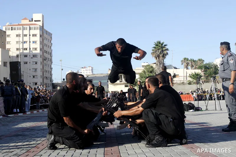 Palestinian Hamas security forces show their skills during a graduation ceremony at the Arafat police compound in Gaza City on July 28, 2011. Photo by Naaman Omar