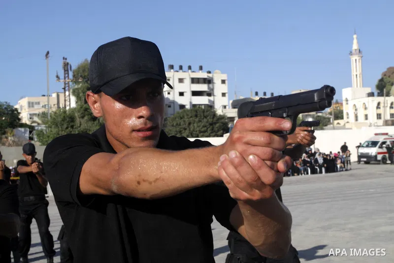 Palestinian Hamas security forces show their skills during a graduation ceremony at the Arafat police compound in Gaza City on July 28, 2011. Photo by Naaman Omar