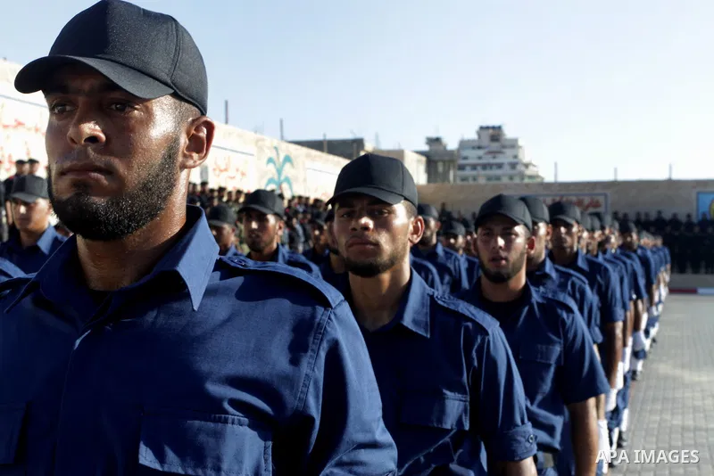 Palestinian Hamas security forces march during a graduation ceremony at the Ansar police compound in Gaza City on July 28, 2011. Photo by Naaman Omar