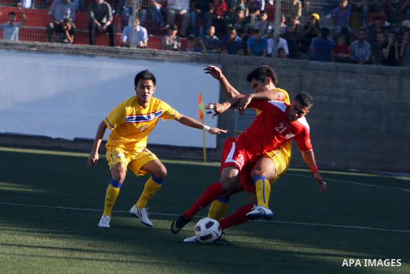 Palestinian's team and Thailand's team fight for the ball during their 2014 FIFA World Cup qualification soccer match at A-Ram stadium near Jerusalem July 28, 2011. Photo by Issam Rimawi