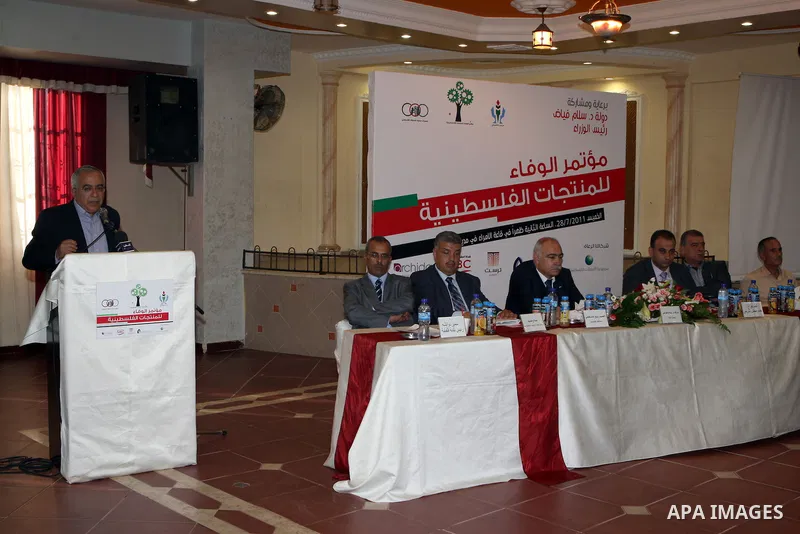 Palestinian Prime Minister, Salam Fayyad during the closing session of al-wafaa` conference of the Palestinian products in the West Bank city of Qalqilya on July 28, 2011. Photo by Mustafa Abu Dayeh