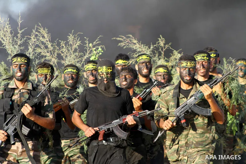 Militants of the Palestinian Islamic Jihad demonstrate their skills during a graduation ceremony in Nusirat in the central Gaza Strip July 28, 2011. Photo by Ashraf Amra