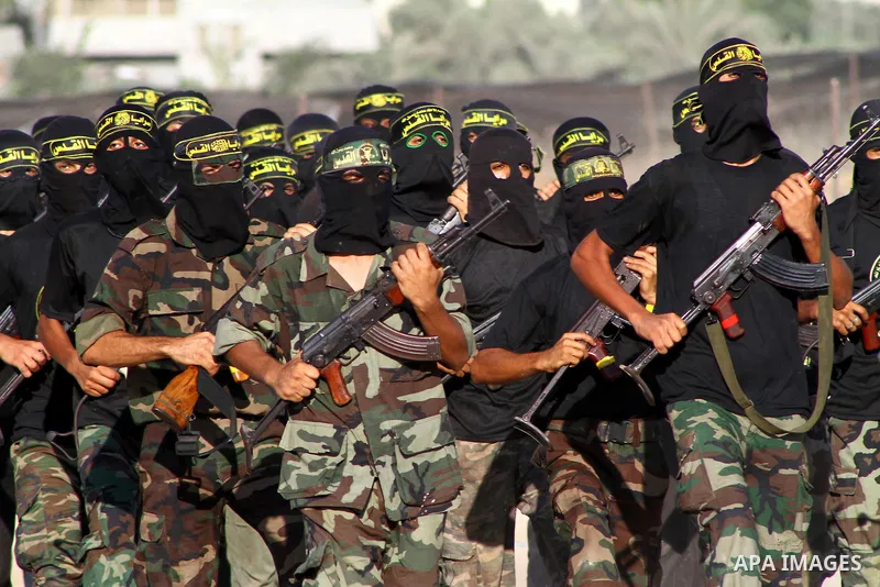 Militants of the Palestinian Islamic Jihad demonstrate their skills during a graduation ceremony in Nusirat in the central Gaza Strip July 28, 2011. Photo by Ashraf Amra