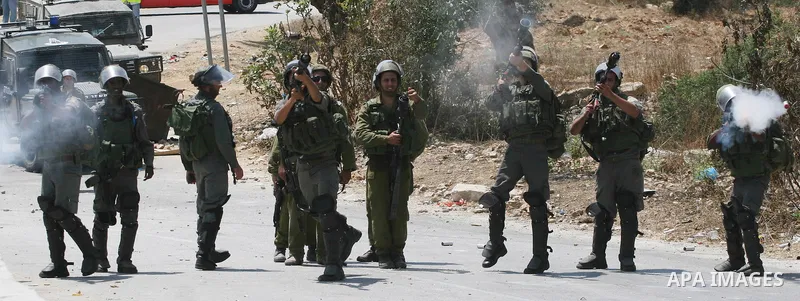 Israeli soldiers clash with Palestinian protesters from the West Bank village of Nabi Salih, north of Ramallah July 29, 2011. Photo by Issam Rimawi