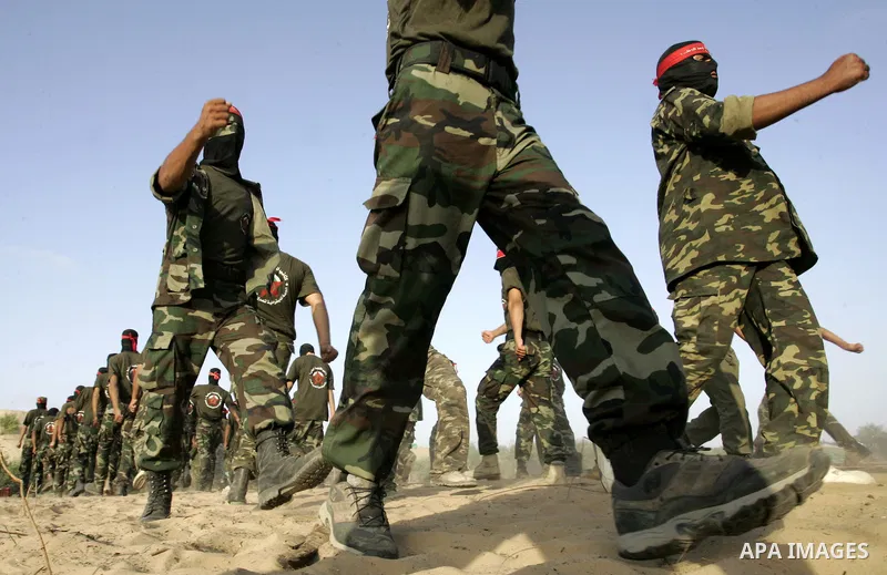 Militants of the Democratic Front for Liberation Palestine (DFLP) train during a military graduation ceremony in Rafah, southern Gaza Strip, on July 29, 2011. Photo by Abed Rahim Khatib