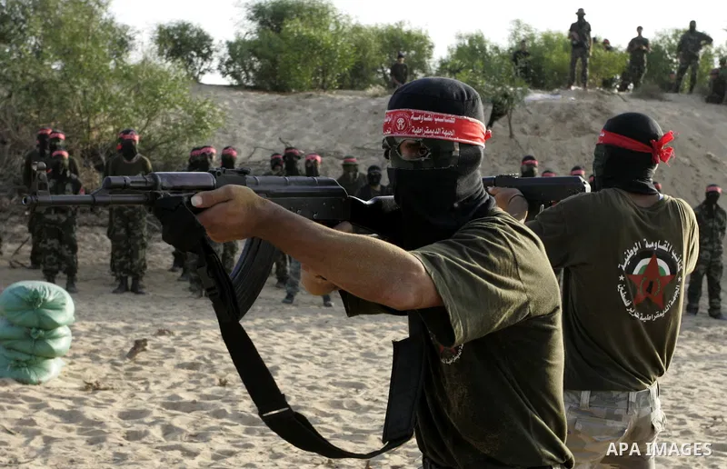 Militants of the Democratic Front for Liberation Palestine (DFLP) train during a military graduation ceremony in Rafah, southern Gaza Strip, on July 29, 2011. Photo by Abed Rahim Khatib