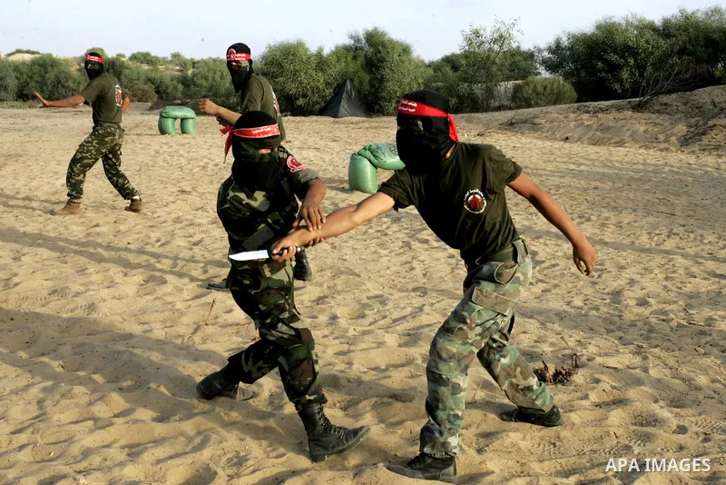 Militants of the Democratic Front for Liberation Palestine (DFLP) train during a military graduation ceremony in Rafah, southern Gaza Strip, on July 29, 2011. Photo by Abed Rahim Khatib