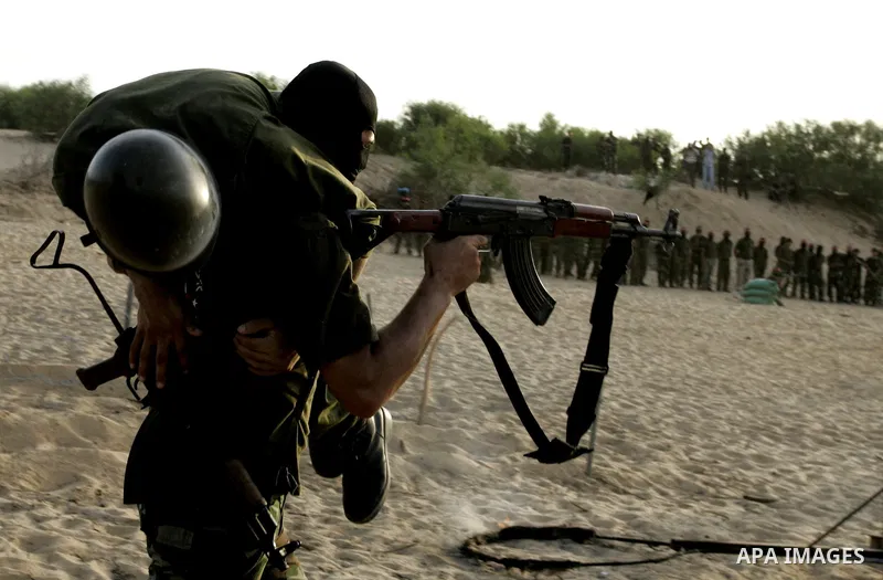 Militants of the Democratic Front for Liberation Palestine (DFLP) train during a military graduation ceremony in Rafah, southern Gaza Strip, on July 29, 2011. Photo by Abed Rahim Khatib