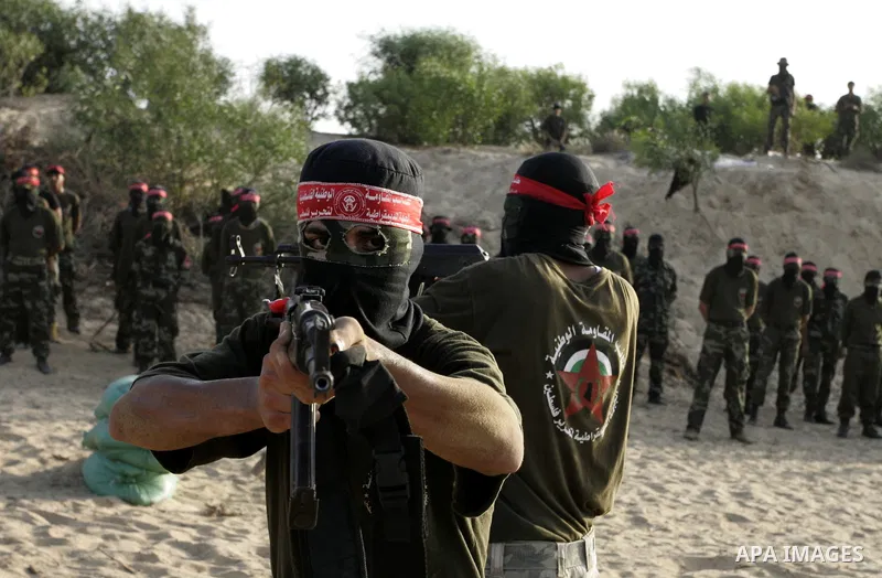 Militants of the Democratic Front for Liberation Palestine (DFLP) train during a military graduation ceremony in Rafah, southern Gaza Strip, on July 29, 2011. Photo by Abed Rahim Khatib