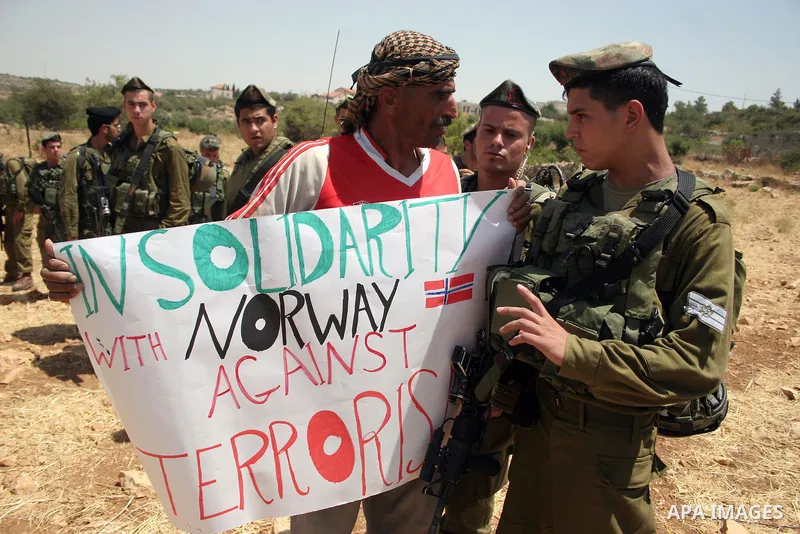 Palestinian protesters argue with Israeli soldiers during a demonstration against Israel's controversial separation barrier in the West Bank village of Beit Omar, near Hebron, 30 July 2011. Israel says the network of ste...