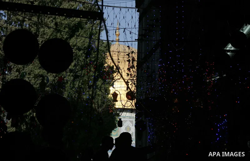 Palestinians walks under decorations ahead of the Muslim holy month of Ramadan in Jerusalem's Old City July 30, 2011. Muslims around the world abstain from eating, drinking and sexual relations from sunrise to sunset dur...