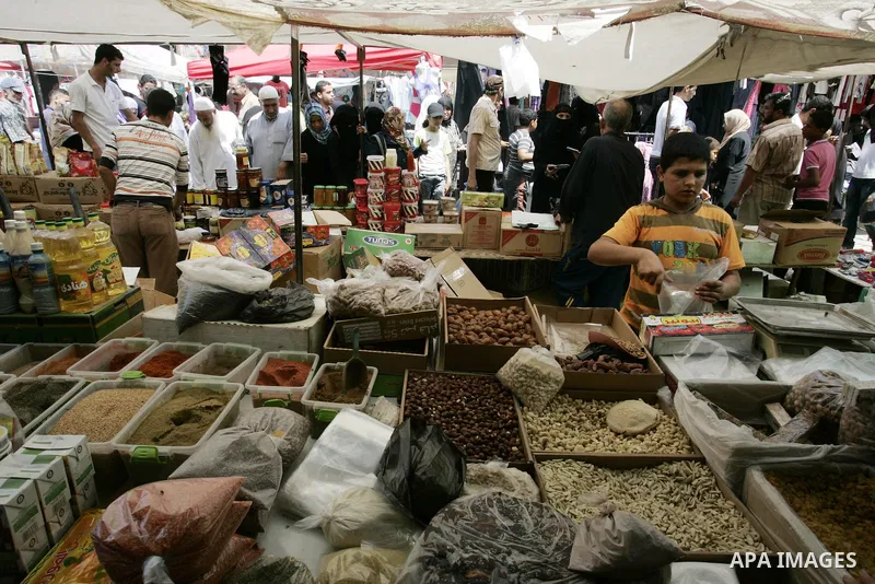 Palestinians shop for food ahead of the Muslim holy fasting month of Ramadan at at market Rafah, southern Gaza Strip on July 30, 2011. Photo by Abed Rahim Khatib