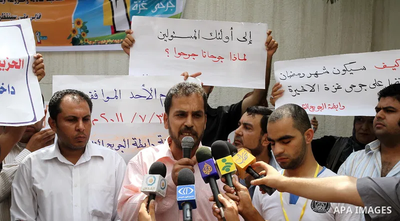 Palestinians wounded deliver speech in a press conference during a protest, demanding the authority of Ramallah to grant them their rights and entitlements in Gaza city on July 31, 2011. Photo by Mohammed Asad