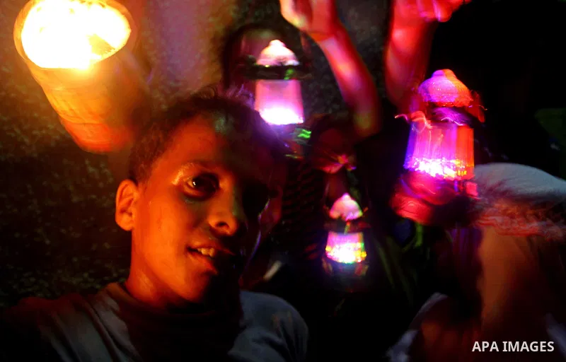 A Palestinian boy plays with fire crackers celebrating ahead of the Muslim holy month of Ramadan, in Der El-Balah southern Gaza Strip on July 31, 2011, where today is the complement of the month of Sha'ban, and tomorrow...
