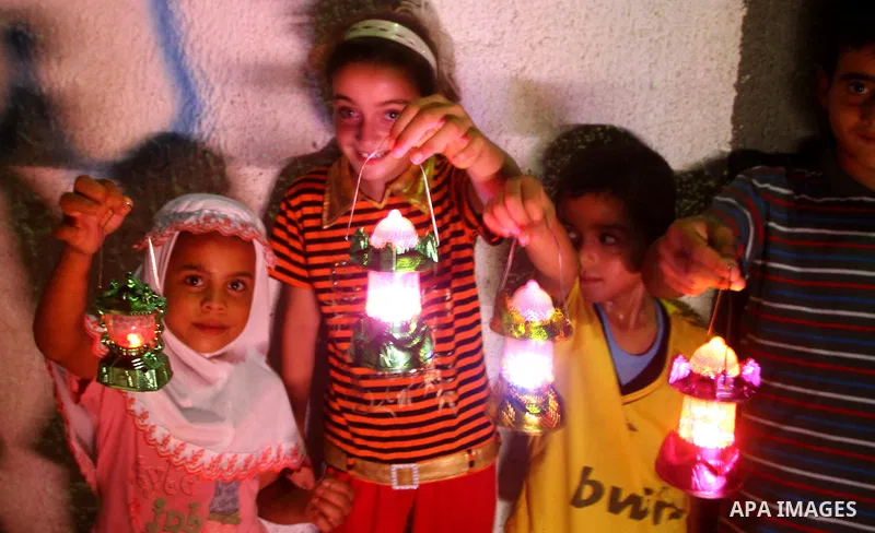 Palestinian Children plays with fire crackers celebrating ahead of the Muslim holy month of Ramadan, in Der El-Balah southern Gaza Strip on July 31, 2011, where today is the complement of the month of Sha'ban, and tomorr...