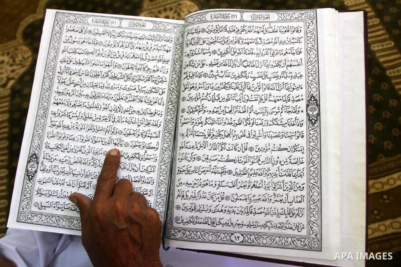 A Palestinian man reads the holy koran on the first day of holy fasting month of Ramadan at al-Omari mosque in Gaza city on Aug. 1, 2011. Throughout the holy month of Ramadan devout Muslims must abstain from food, drink...