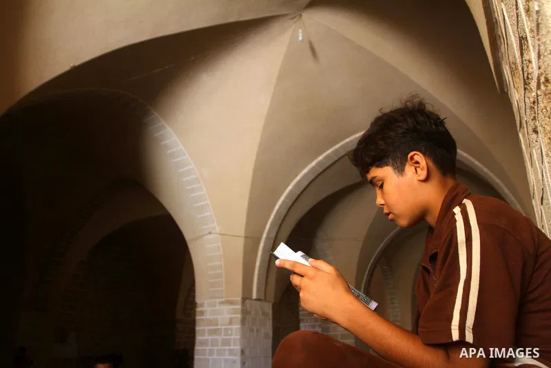 A Palestinian boy reads the holy koran on the first day of holy fasting month of Ramadan at al-Omari mosque in Gaza city on Aug. 1, 2011. Throughout the holy month of Ramadan devout Muslims must abstain from food, drink...