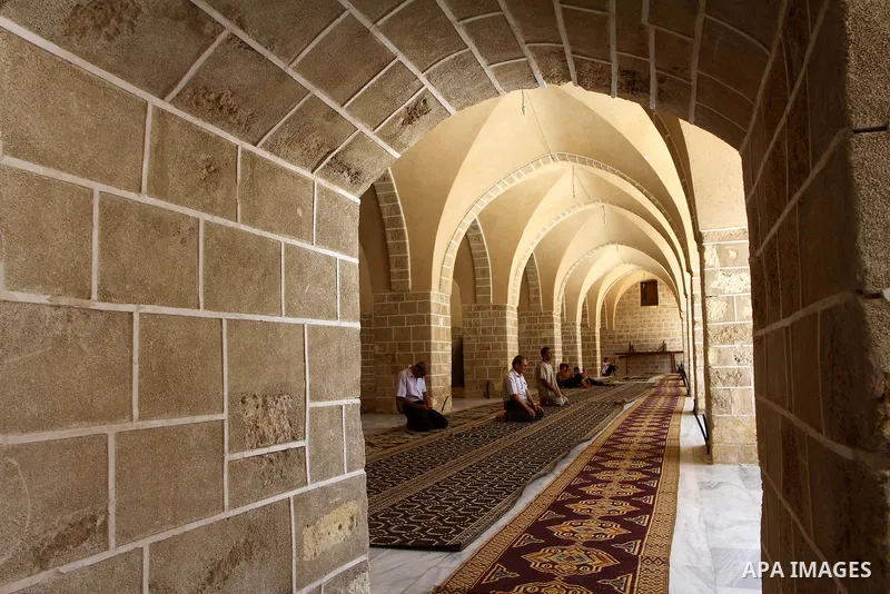 Palestinian men perform praying at al-Omari mosque on the first day of holy fasting month of Ramadan in Gaza city on Aug. 1, 2011. Throughout the holy month of Ramadan devout Muslims must abstain from food, drink and sex...