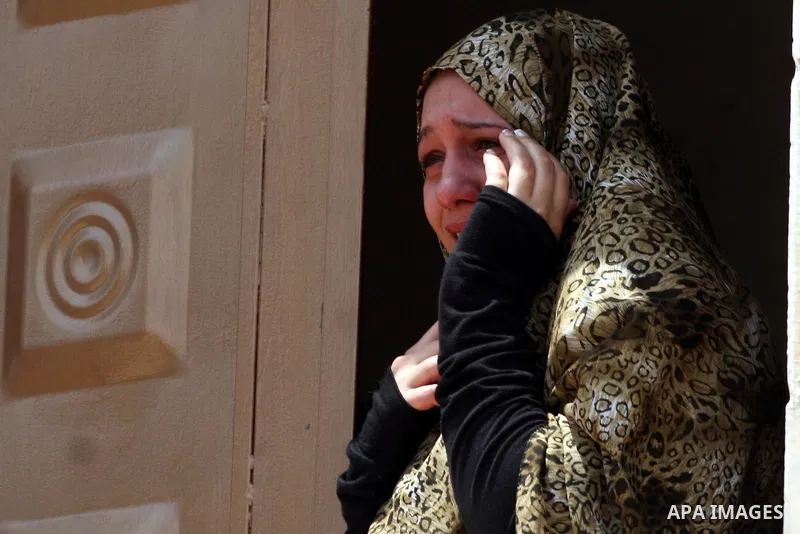 A Palestinian woman cries during the funeral of Moatasem Edwan ,22, and Ali Khalifeh, 25, who were killed by Israeli military in the Qalandiya refugee camp near the West Bank city of Ramallah, Monday, Aug. 1, 2011. A Pal...