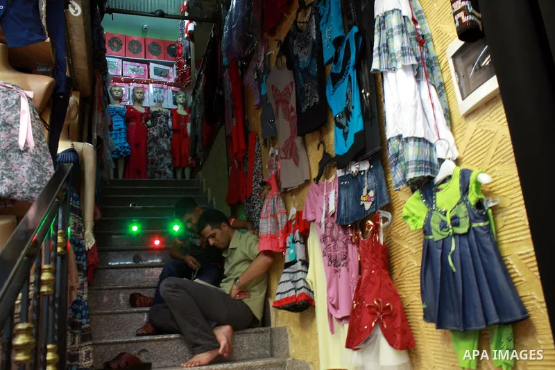 Palestinian vendor reads the Quran, Islam's holy book for Ramadan, in a shop in the West Bank city of Nablus, on Aug. 1, 2011. Muslims throughout the world are celebrating the holy fasting month of Ramadan, the holiest m...