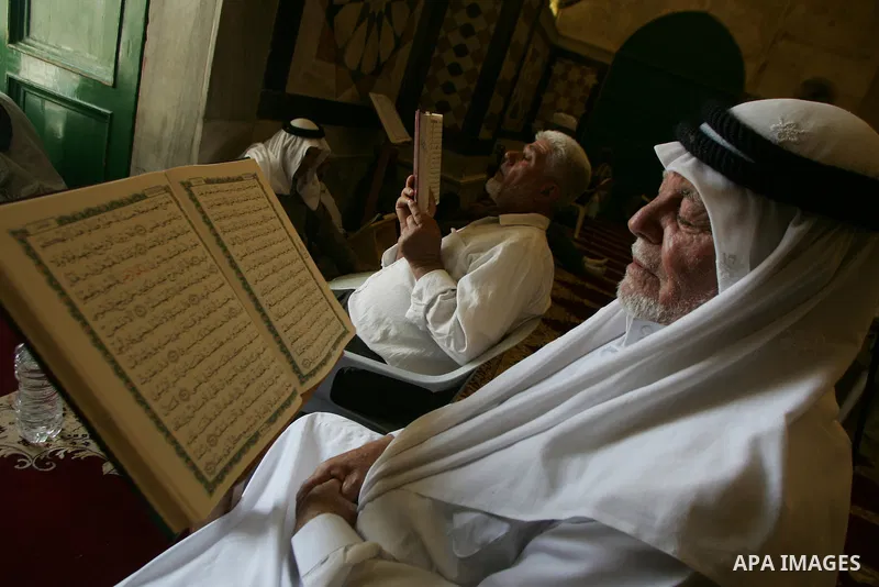 A Palestinian man reads the holy koran on the first day of holy fasting month of Ramadan in Jerusalem on Aug 1, 2011. Throughout the holy month of Ramadan devout Muslims must abstain from food, drink and sex from dawn un...