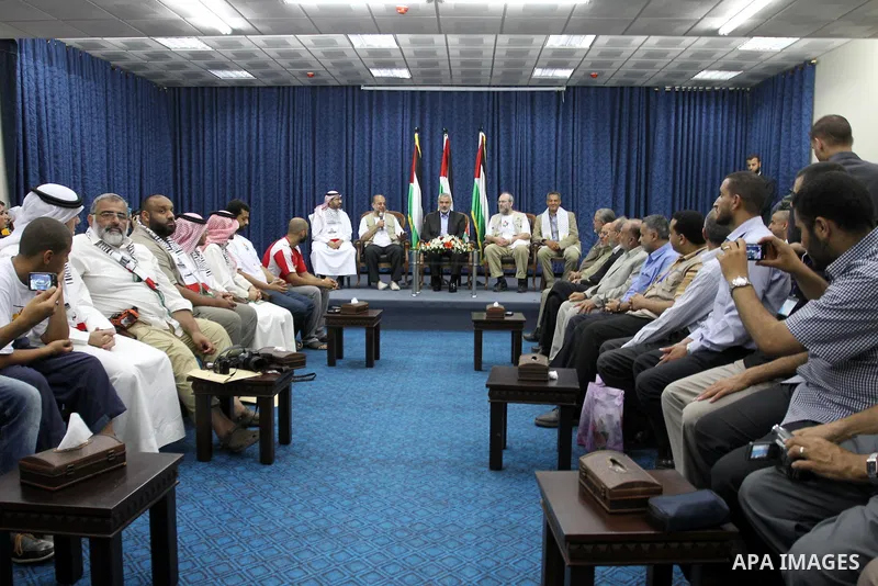 Palestinian Prime Minister in Gaza strip, Ismail Haniya during a meeting with members of the aid convoy 'Miles of Smiles 4' in Gaza city on Aug. 1, 2011 . The convoy, including 35 activists from Spain, the UK and Bahrain...