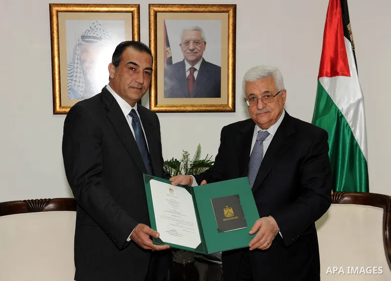 Palestinian President Mahmoud Abbas (Abu Mazen) grants Order of Merit and Excellence for Adnan Mujally, in the West Bank city of Ramallah on Aig. 1, 2011. Photo by Mohammed Ateeq