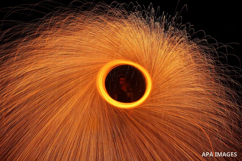 Palestinian boy plays with fireworks to celebrate the beginning of the Muslim holy fasting month of Ramadan in Gaza City on 01 August 2011. Muslims throughout the world are celebrating the holy fasting month of Ramadan,...