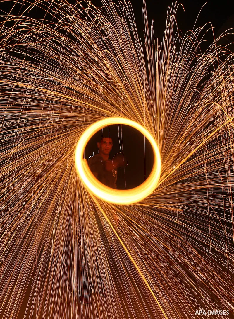 Palestinian boy plays with fireworks to celebrate the beginning of the Muslim holy fasting month of Ramadan in Gaza City on 01 August 2011. Muslims throughout the world are celebrating the holy fasting month of Ramadan,...