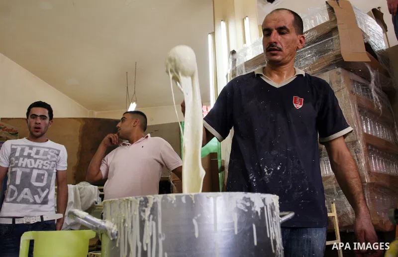 A Palestinian vendor prepares qatayef, a traditional pancake for Ramadan, at a shop in the West Bank city of Ramallah August 2, 2011. Muslims around the world abstain from eating, drinking and conducting sexual relations...