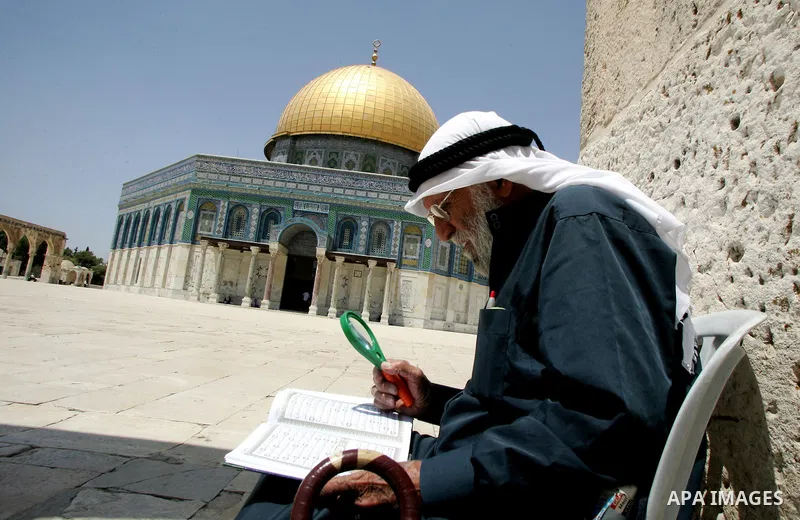 A Palestinian man reads the holy koran on the first day of holy fasting month of Ramadan. Throughout the holy month of Ramadan devout Muslims must abstain from food, drink and sex from dawn until sunset when they break t...
