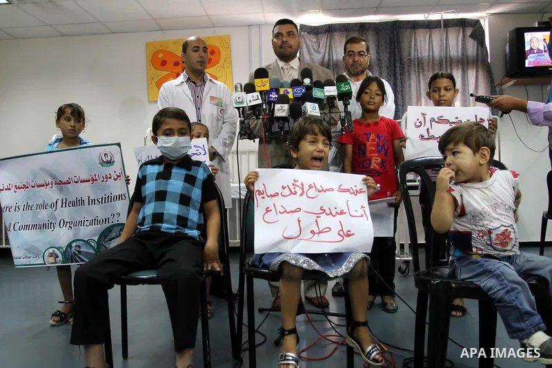 Palestinian official at Al-Rantisi hospital for the children delivers speech during a protest for the lack of medicine, in Gaza city on Aug. 3, 2011, demanding for the introduction of medicines. Photo by Mohammed Asad