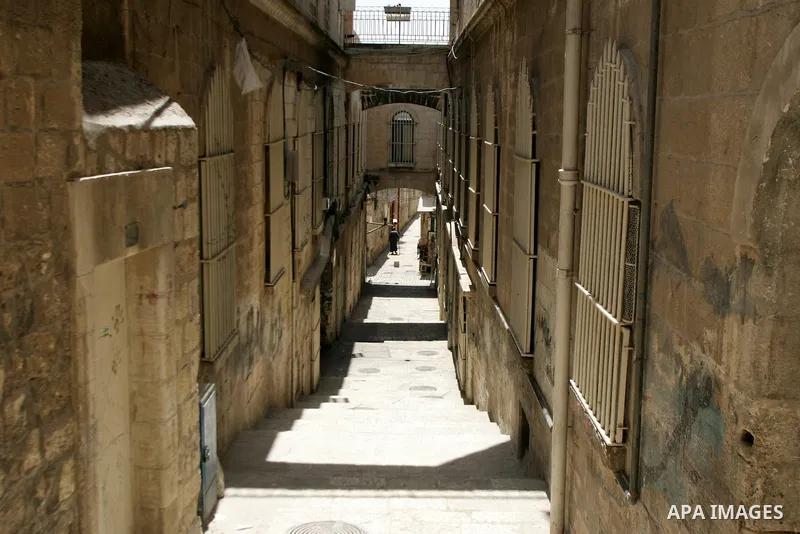 A Palestinians man walks in the alleys of Jerusalem's Old City in the holy month of Ramadan in on Aug. 3, 2011. Muslims around the world abstain from eating, drinking and sexual relations from sunrise to sunset during Ra...