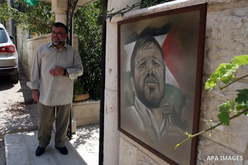 A Palestinian commander of the Hamas Islamist movement, Sheikh Hassan Yusef, 56, stands near his home in the West Bank city of Ramallah after he was released from an Israeli jails, on Aug. 4, 2011. as Israel free 770 Isr...