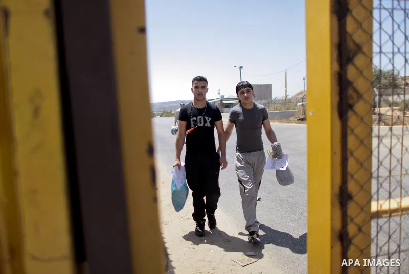 Palestinian prisoners seen crossing the border after they were released from Israeli prison, at the checkpoint of Betwnia next to the Israeli Military prison of Ofer, south of the West Bank town of Ramallah, 04 August 20...