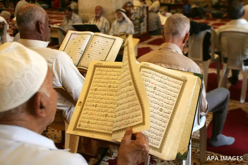 A Palestinian man reads the holy koran on the first day of holy fasting month of Ramadan in Jerusalem. Throughout the holy month of Ramadan devout Muslims must abstain from food, drink and sex from dawn until sunset when...
