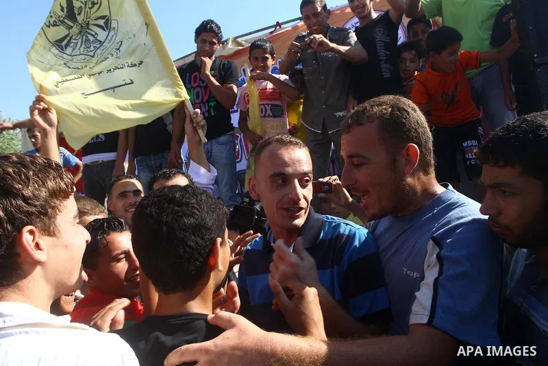 Palestinians welcome back prisoners released from Israeli prisons at the Erez checkpoint in the northern Gaza Strip, following their release at the Erez crossing by Israeli border police, 04 August 2011. In total, 75 Pal...