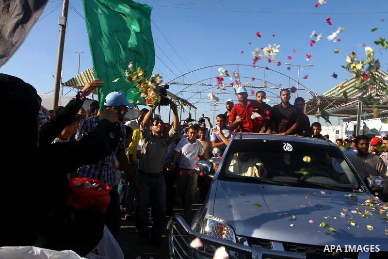Palestinians welcome back prisoners released from Israeli prisons at the Erez checkpoint in the northern Gaza Strip, following their release at the Erez crossing by Israeli border police, 04 August 2011. In total, 75 Pal...